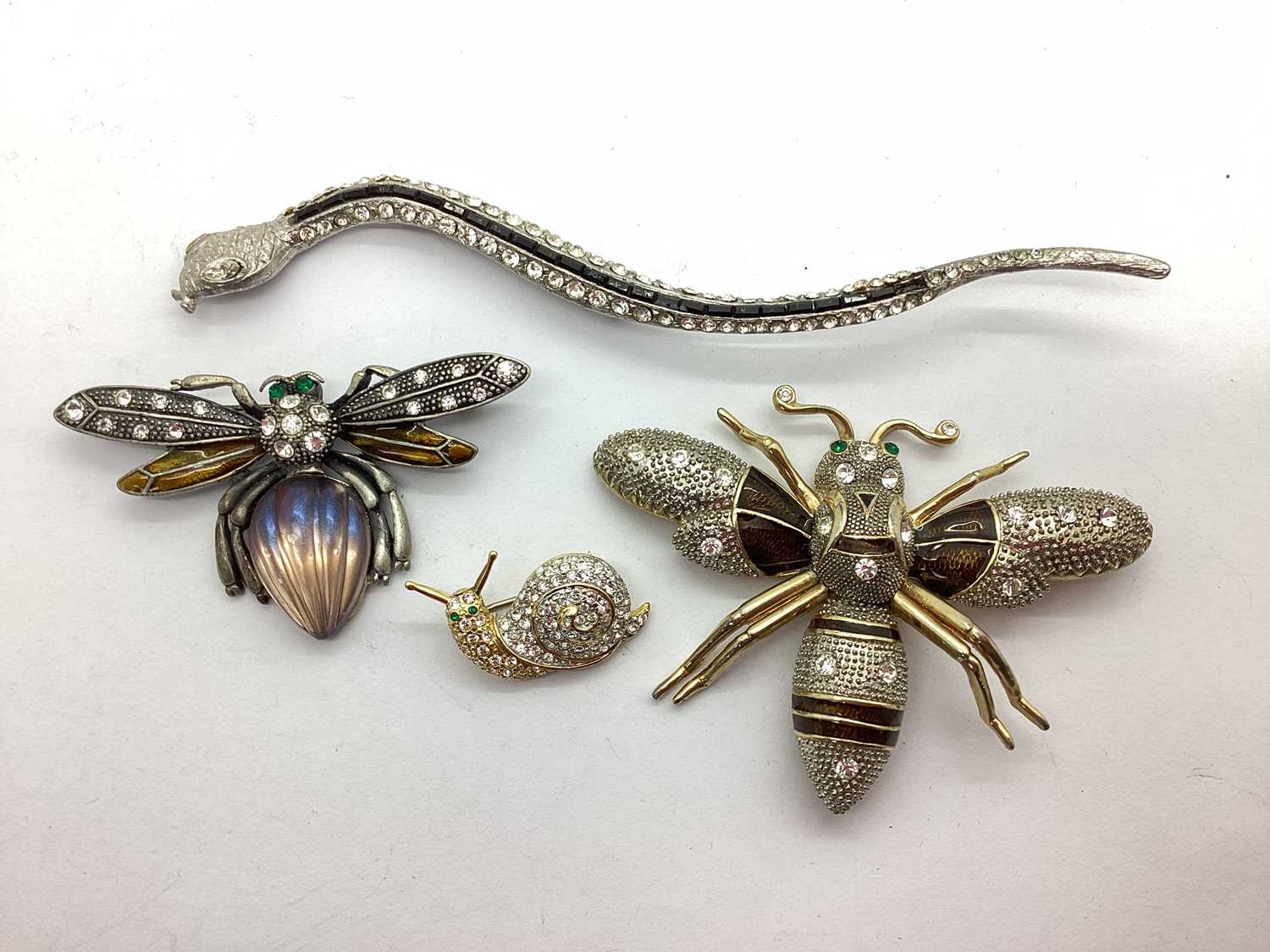 A Small Collection of Ornate Inset Brooches, including insects, snake and a snail.