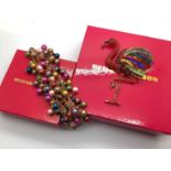 Butler & Wilson; A Modern Wide Bracelet, boxed; Together with A Butler & Wilson Large Flamingo