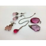 A Small Collection of Faceted Glass Jewellery, in hues of pink, including a pear shaped pendant,