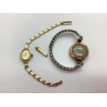 Soverign Quartz; A 9ct Gold Cased Ladies Wristwatch, the signed champagne coloured dial, within