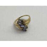 A 9ct Gold Ornate Style Ring, the marquise cut stones claw set throughout, to scroll style shoulders