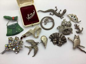 A Small Collection of Brooches, including a Victorian anchor brooch, a circular marcasite set