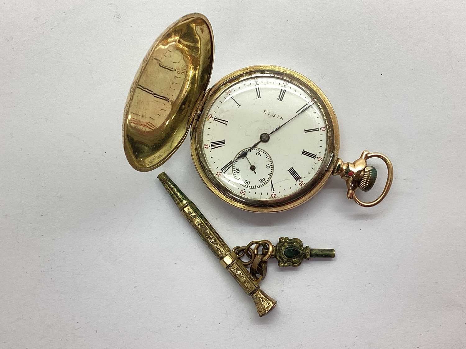 Elgin; A Hunter Cased Pocket Watch, the signed dial with black Roman numerals, red Arabic numerals