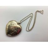 A Large Modern Heart Shape Locket Pendant, leaf scroll engraved decoration, stamped inside "925", on