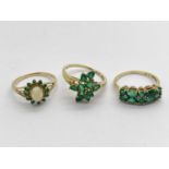 A 9ct Gold Opal and Emerald Set Cluster Ring, between dainty bifurcated shoulders, (finger size