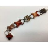 A Victorian Banded Agate Panel Bracelet, the shaped links with chain connections, to hook and