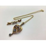 An Edwardian Openwork Pendant, circular and oval collet set, on a modern 9ct gold chain; together