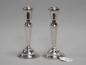A Pair of Hallmarked Silver Candlesticks, B&Co, Birmingham 1975, each of plain tapering form with