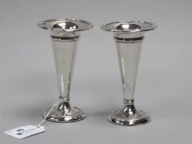 A Pair of Hallmarked Silver Vases, (marks rubbed) each of plain tapering cylindrical form with shell