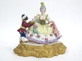 A XX Century German Porcelain Figure Group, modelled as a lady seated in evening dress, a boy beside