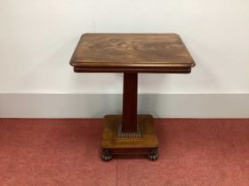 A Mid XIX Century Rosewood Side Table, the rectangular top raised on a tapered support and a