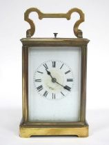 An Early XX Century Brass Cased Carriage Clock, the white enamel dial with Roman numerals, 13cm high