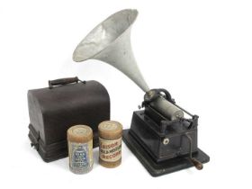 An Edison Gem Phonograph, with side turning handle, on a wooden base and cover, metal horn and one