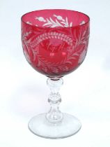 A Large Glass Goblet, dated 1875, the 'U' shaped cranberry bowl engraved with scrolling flowers