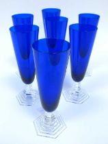 Seven Baccarat Crystal 'Orsay' Champagne Flutes, in cobalt blue on stepped hexagonal foot, etched