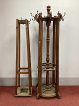 An Early XX Century Oak Hat/Umbrella Stand, of circular form with brass hooks, 97cm high; Another,