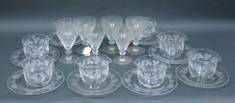 A Set of Six Cut Glass Wine Glasses, the bowls etched with grapes and vine leaves on knopped stem