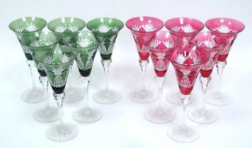 A Set of Six Cut Glass Wine Glasses, with ruby bowls on clear stems and a similarly cut set of six