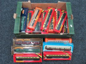 Seventeen OO Gauge Outline British Coaches by Hornby, Mainline and other, boxed.