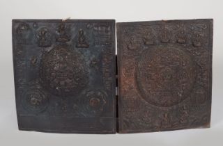 TWO 19TH-CENTURY TIBETAN COPPER MANDALA PLAQUES