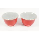 PAIR OF CHINESE QING CORAL GLAZED BOWLS