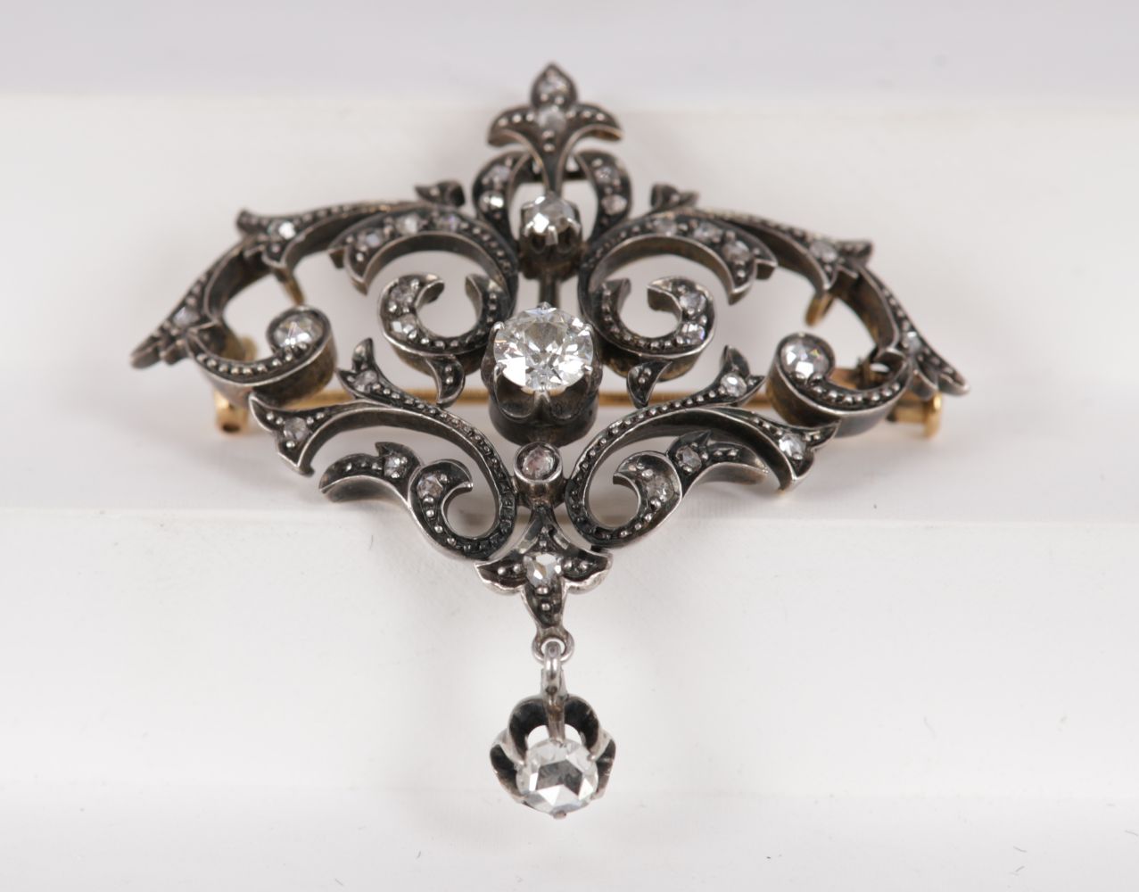 GOLD, DIAMOND & SILVER VOLUTE BROOCH