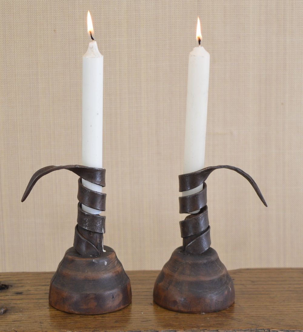 PAIR VERNACULAR IRON COW TAIL CANDLESTICKS