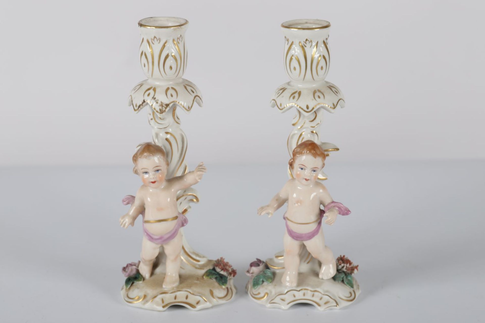 PAIR GERMAN PORCELAIN CHERUB STEMMED CANDLESTICKS