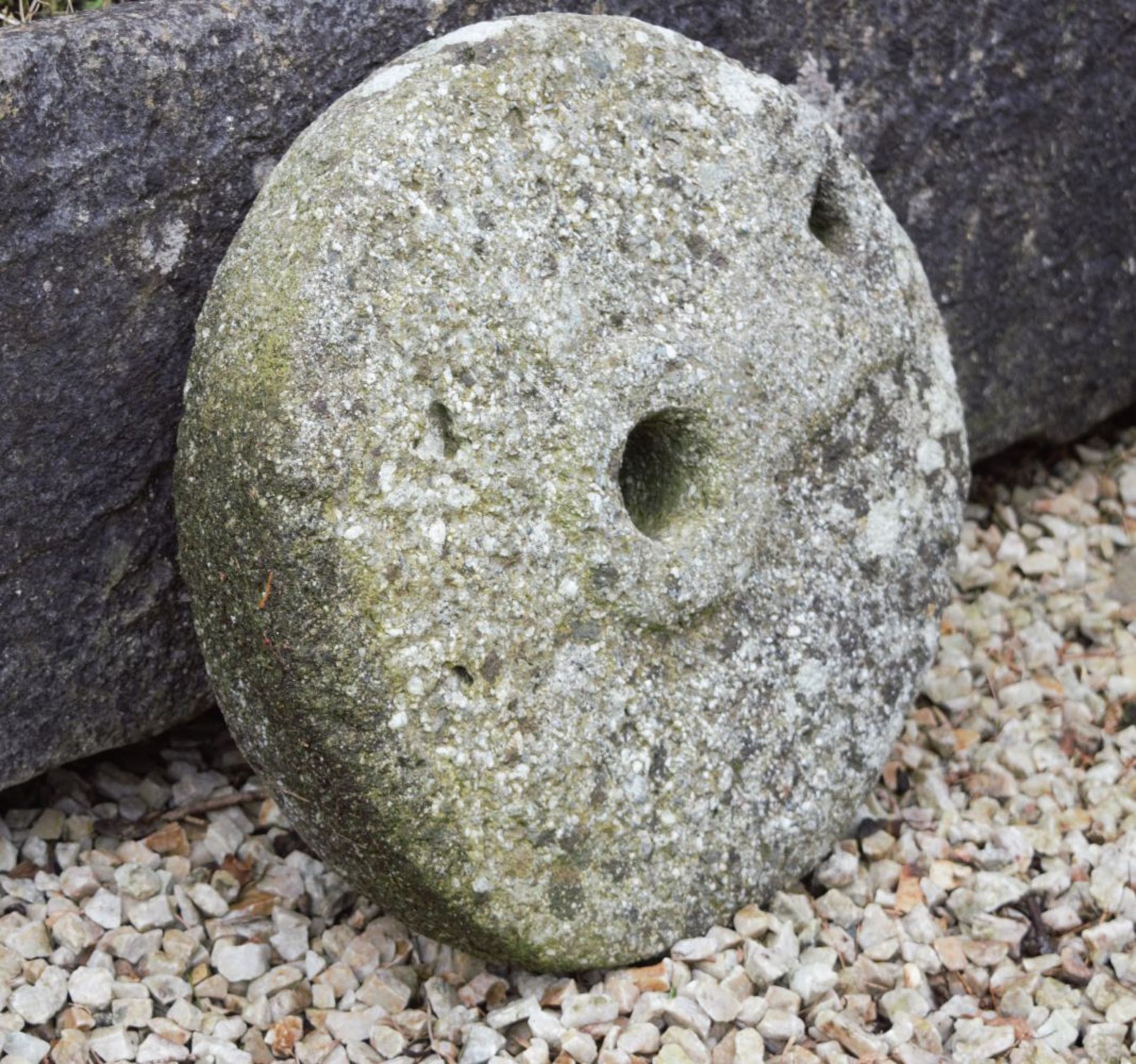 WITHDRAWN GRINDING STONE
