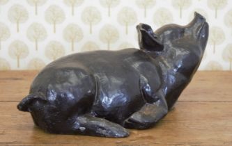 MODEL OF A SEATED PIGLET