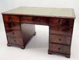 A Georgian mahogany twin pedestal desk with leather inset top over nine drawers, 129cm wide x 72cm