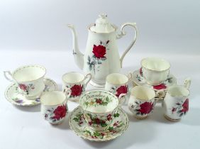 A Royal Albert Sweet Romance pattern coffee set together with two Royal Albert flowers of the