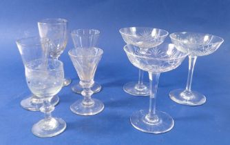 A group of antique glass and three cocktail glasses