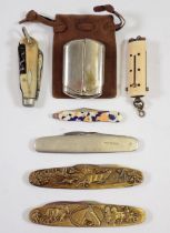 Five various penknives and a chatelaine necessaire with pencil, toothpick, knife and button hook