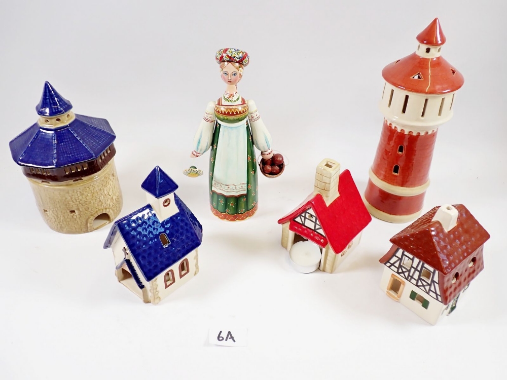 Five Bavarian candle houses including boxed lighthouse and painted wooden figure