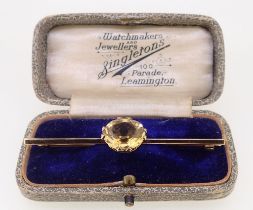 A 9 carat gold bar brooch set oval cut citrine, 4g - boxed, 6.2cm unmarked but tested