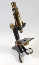 An early 20th century brass monocular microscope by Baker, Holbourne, London