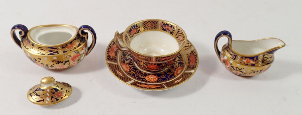A Royal Crown Derby miniature covered sugar bowl, jug and teacup, 3cm tall - Image 2 of 2