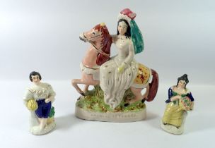 A Victorian Staffordshire group Empress of France and a groupd with lady with basket of fruit and