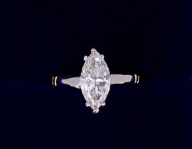 An 18 carat gold and platinum set marquise cut diamond ring, approximately one carat, size L, boxed