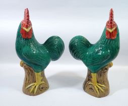 A pair of Chinese glazed pottery cockerels 32cm tall