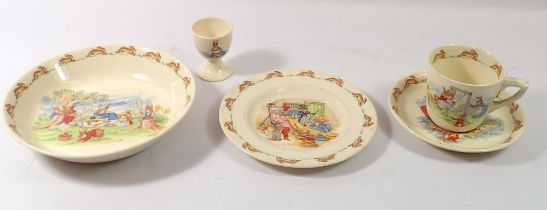 A Doulton Bunnykins bowl, trio and egg cup