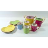 An Yves Saint Laurent harlequin set of four coffee cups on heart form saucers with cream jug and