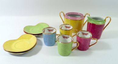 An Yves Saint Laurent harlequin set of four coffee cups on heart form saucers with cream jug and