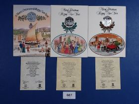 Three Pobjoy Mint Isle of Man silver proof Christmas fifty pences, each mounted in Christmas card,