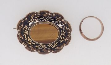 A Victorian gold oval brooch set tigers eye with enamel surround 15.5g total weight (unmarked but