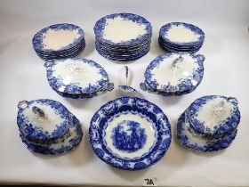 An Edwardian blue and white dinner service comprising: two covered tureens (one handle a/f), two