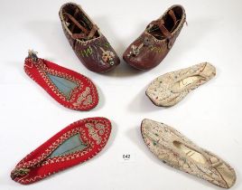 Two pairs of embroidered shoes and a pair of leather shoes