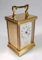 A Woodford brass carriage clock, 14cm tall