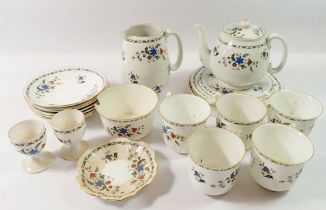 A Shelley floral part tea service comprising teapot and stand, two egg cups, five cups and seven
